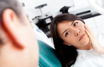 Woman in Dentist Chair with Pain