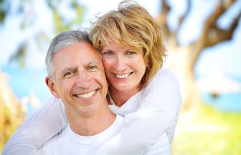 senior couple with perfect smiles